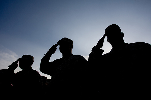 Georgia National Guardsmen salute during a Fall Warrior ceremony in Afghanistan